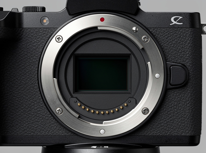 Close-up of a Canon RF mount showing the metal flange contacts and the short flange distance on a camera body