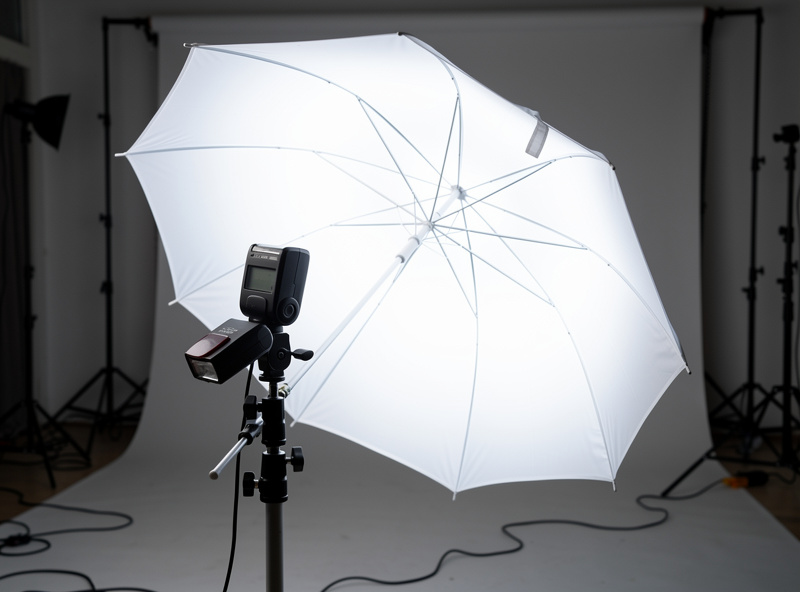 Portrait lit with a 33-inch white shoot-through umbrella showing soft wrap-around light quality