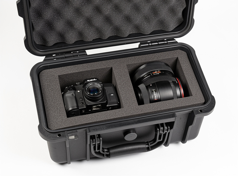 Camera bodies and lenses packed in foam inside a rugged waterproof hard case