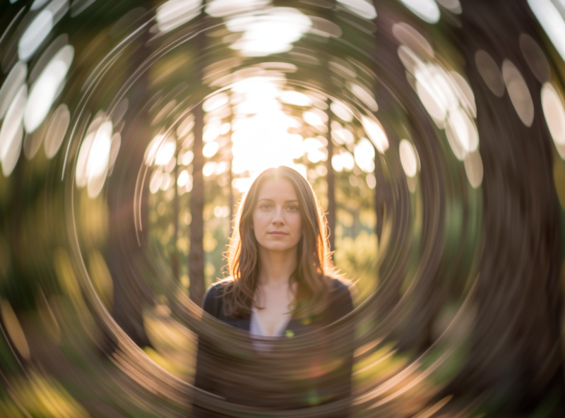 Portrait with a swirly bokeh background wrapping around the subject shot on a Helios 44-2 at f2