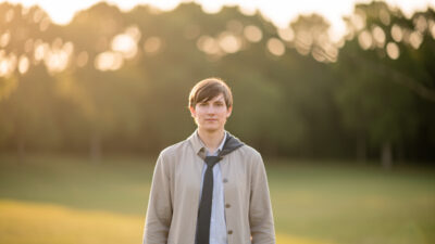 Portrait with strong subject separation rendering a deeply blurred background without a fast lens