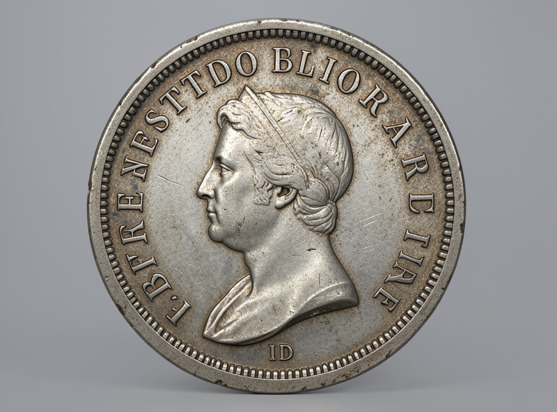 A finished focus-stacked macro photograph of an engraved silver coin, sharp from centre to every edge