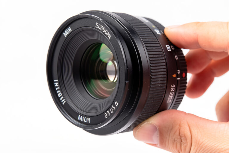 A variable ND filter being rotated on a mirrorless camera lens